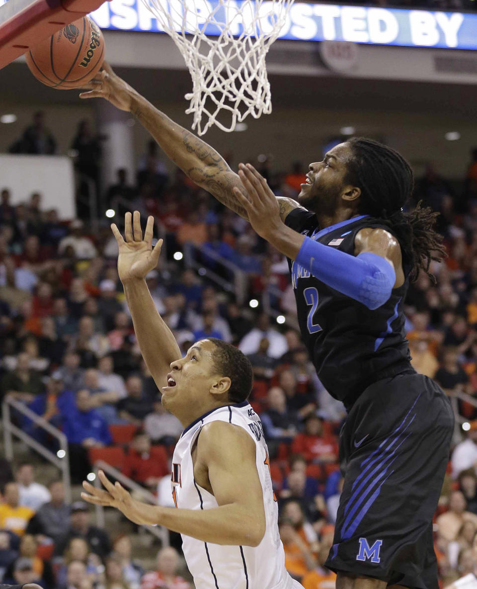 Memphis forward Shaq Goodwin (2) blocks a shot by Virginia guard Malcolm Brogdon (15) during the first half of an NCAA college basketball third-round tournament game, Sunday, March 23, 2014, in Raleigh. (AP Photo/Gerry Broome)