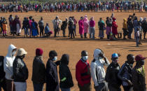 FILE — In this May 20, 2020 file photo, people affected by the coronavirus economic downturn line up to receive food parcels in Pretoria, South Africa, South Africa's economy is expected to decline by 7.2% this year, its worst performance in 90 years, as the coronavirus pandemic takes a toll on sub-Saharan Africa's most developed country. (AP Photo/Themba Hadebe/File)