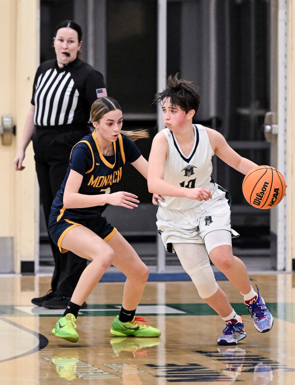 El Diamante's Olivia Torres, right, goes around Monache's Kyah Bartlett in an East Yosemite League high school girls basketball game  Friday, January 13, 2023. 