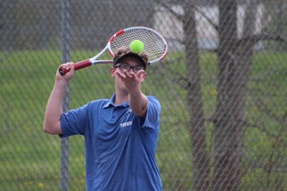 Ravenna's Dylan Phelps prepares a serve at the Metro Athletic Conference Championships on Wednesday, May 4, 2022.