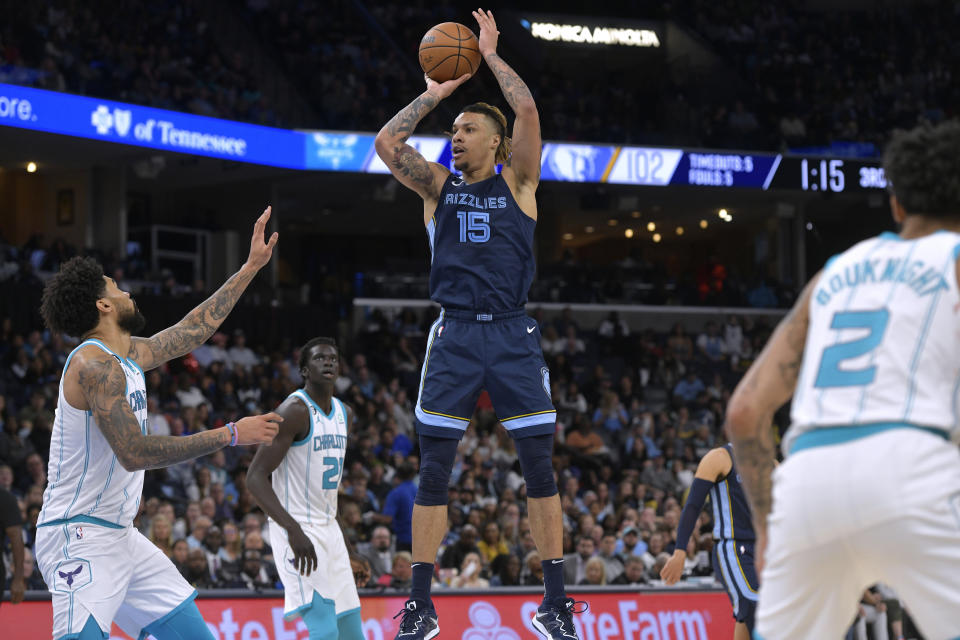 Memphis Grizzlies forward Brandon Clarke (15) shoots against Charlotte Hornets center Nick Richards (4) during the second half of an NBA basketball game Friday, Nov. 4, 2022, in Memphis, Tenn. (AP Photo/Brandon Dill)