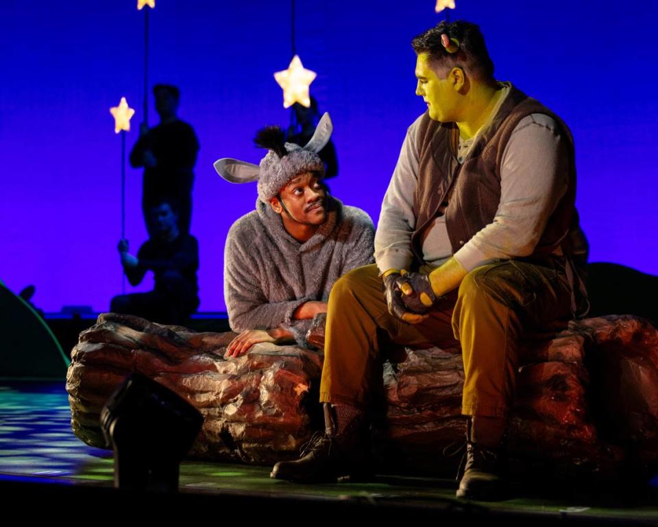 A press photo of “Shrek the Musical” from a production starring Naphtali Yaakov Curry as Donkey and Nicholas Hambruch as Shrek.