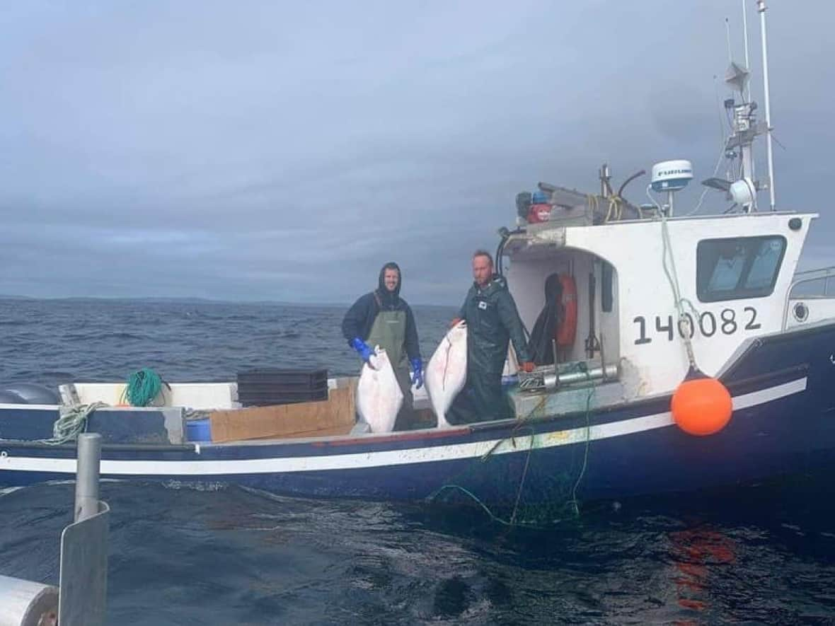 Marc Russell and Joey Jenkins are pictured aboard the Island Lady. The pair was last heard from on Sept. 17, 2021.  (Submitted by Dwight Russell  - image credit)