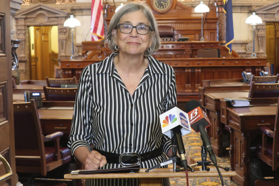 Kansas Senate President Susan Wagle, R-Wichita, pauses while answering questions during a news conference outside the Senate chamber about Democratic Gov. Laura Kelly's veto of a GOP coronavirus bill, Tuesday May 26, 2020, at the Statehouse in Topeka, Kan. While Kelly vetoed the bill, Wagle is declaring victory because the governor also abandoned statewide restrictions on businesses. (AP Photo/John Hanna)