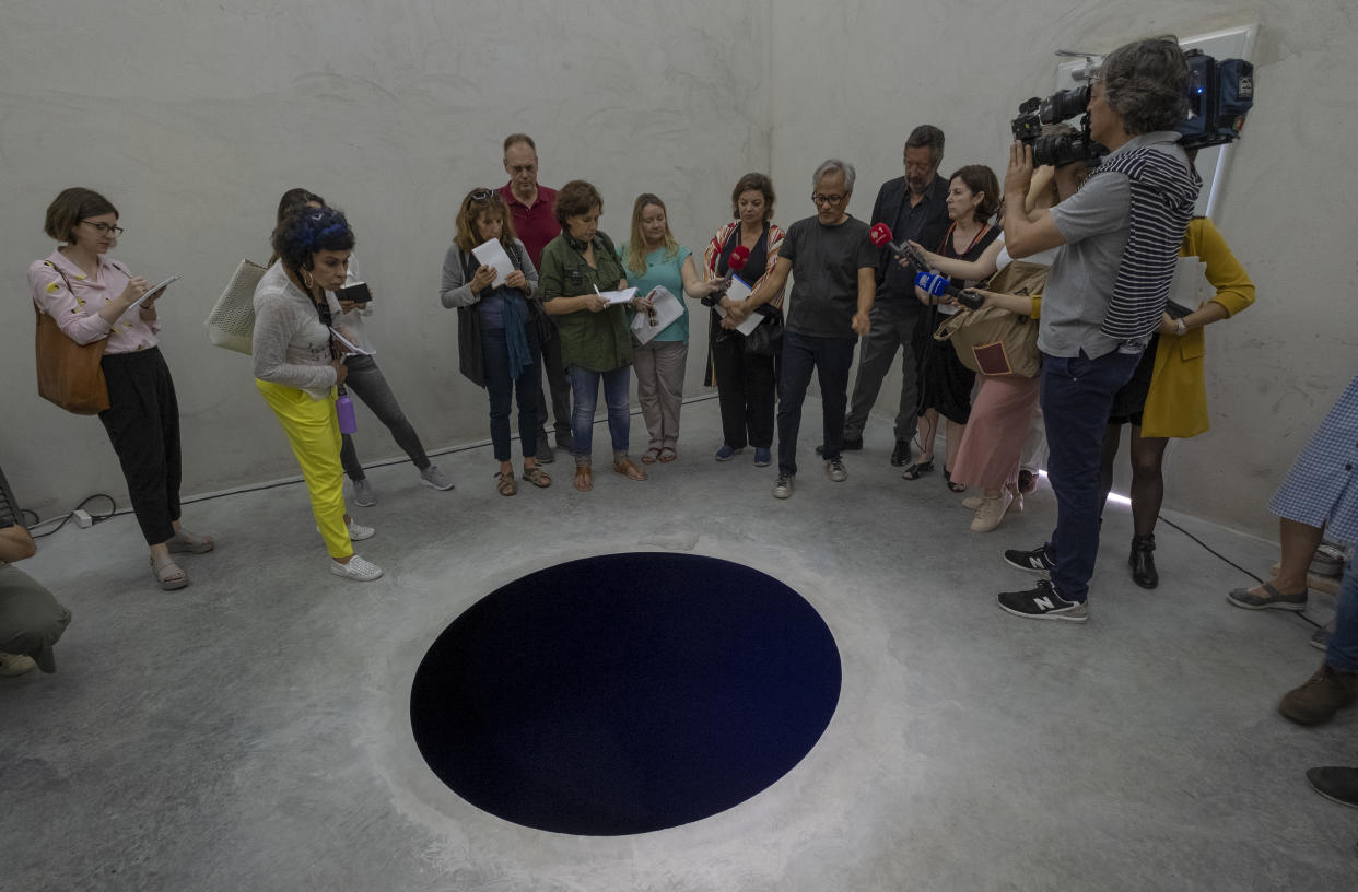 Artist Anish Kapoor talks to journalists inside the cube structure of <em>Descent Into Limbo</em> in Porto, Portugal. (Photo: Horacio Villalobos — Corbis/Corbis via Getty Images)