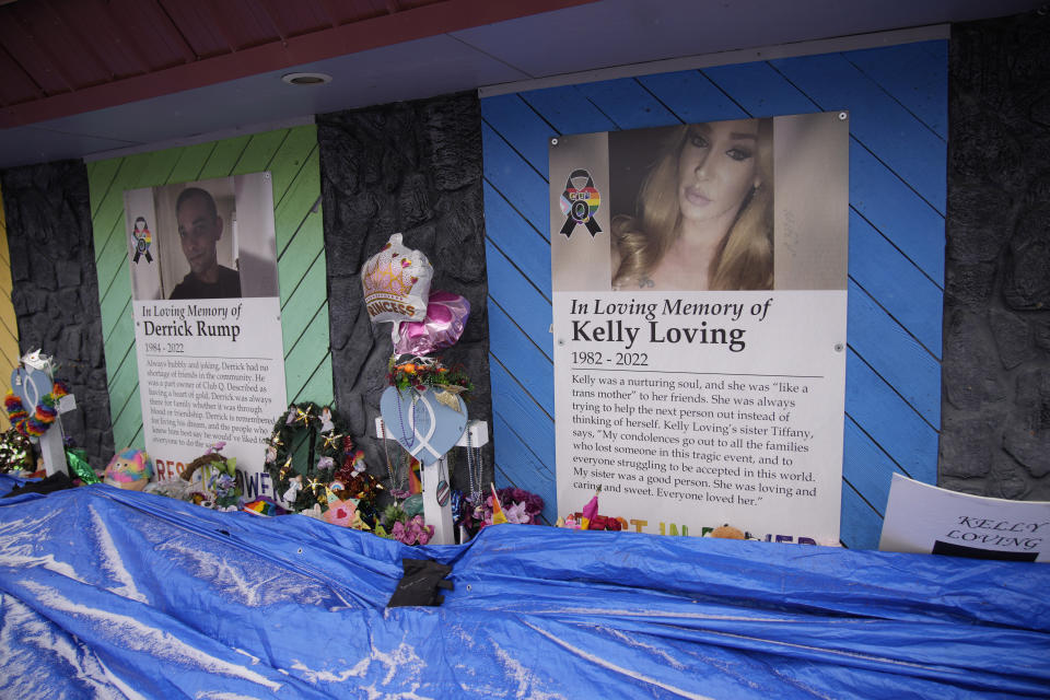 Tributes to the victims of a mass shooting cover the exterior walls of Club Q Wednesday, Feb. 22, 2023, in Colorado Springs, Colo. A Navy sailor grabbed the barrel of a gunman’s rifle and an Army veteran rushed in to help as they ended the deadly mass shooting at the gay nightclub in November, a police detective testified Wednesday. (AP Photo/David Zalubowski)