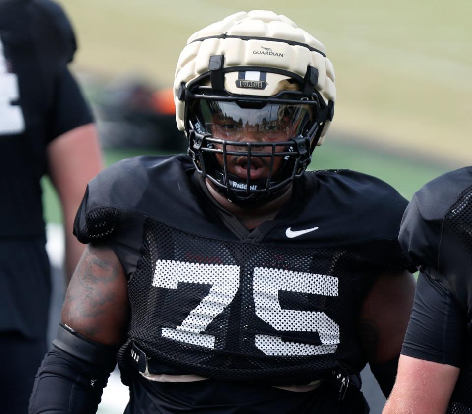 Purdue Boilermakers offensive lineman Jalen Grant (75) runs a drill during football practice, Thursday, Aug. 17, 2023, at Purdue University in West Lafayette, Ind. 