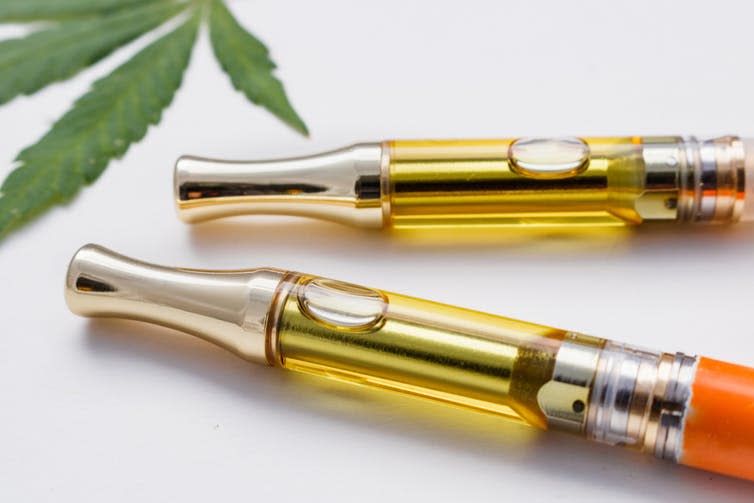 Two vape pens containing cannabis oil.