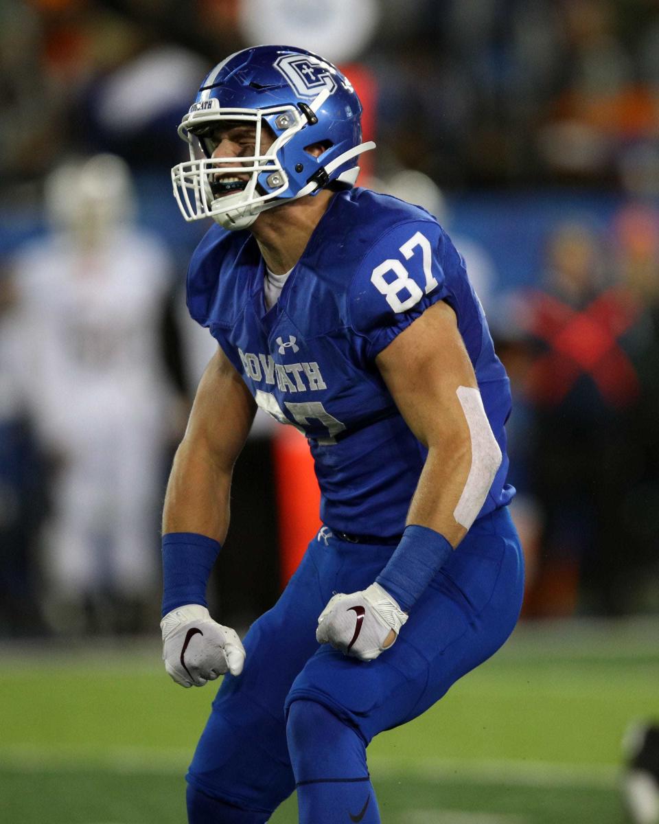 Cov Cath defensive end Michael Mayer celebrates a tackle for a loss in the KHSAA 5A state championship Dec. 7, 2019. Covington Catholic defeated Frederick Douglass 14-7.