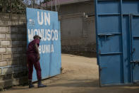 FILE - In this Aug.11, 2016, file photo, a security guard closes the gate of the UN compound in the Congo Ituri province capital Bunia. One by one, African leaders brought their world to U.N. headquarters. They told stories of illiteracy and malnutrition, about people living with HIV and without electricity. The dance the African leaders must perform at the U.N. General Assembly is delicate. (AP Photo/Jerome Delay, File)