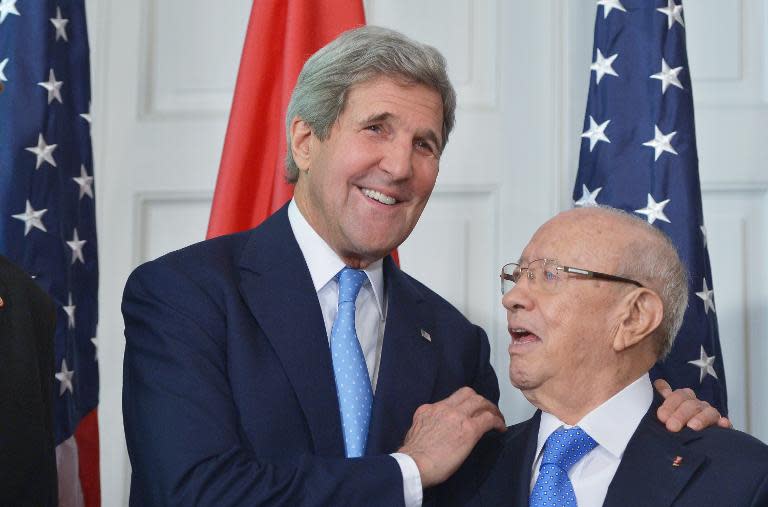 US Secretary of State John Kerry (L) poses with Tunisian President Beji Caid Essebsi after signing an memorandum of understanding at Blair House, the presidential guest house, on May 20, 2015 in Washington, DC