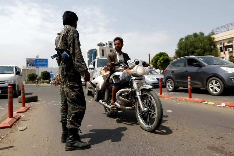 Yemeni soldiers man a checkpoint as authorities tighten security measures ahead of the 35th anniversary of the establishment of ousted president Ali Abdullah Saleh's party, in the capital Sanaa on August 21, 2017