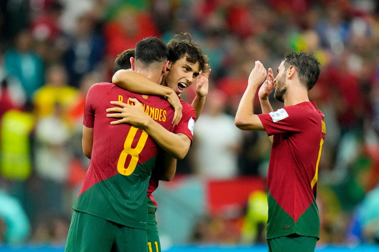Portugal's Bruno Fernandes, João Felix and Bernardo Silva, from left celebrate at the end of the World Cup group H soccer match between Portugal and Uruguay, at the Lusail Stadium, Qatar.