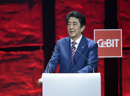 Japanese Prime Minister Shinzo Abe speaks during the opening ceremony of the CeBit computer fair, which will open its doors to the public on March 20, at the fairground in Hanover, Germany, March 19, 2017. REUTERS/Fabian Bimmer