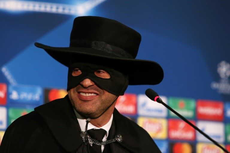 Shakhtar Donetsk's Paulo Fonseca, wearing a Zorro mask and hat, delivers a press conference after Shakhtar Donetsk won their match against Manchester City on December 6, 2017