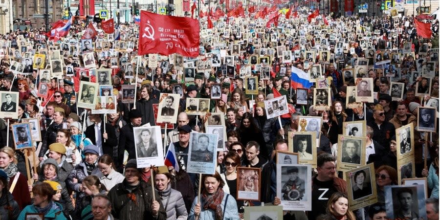 Russians carry portraits of people, including Red Army soldiers, during the Immortal Regiment march