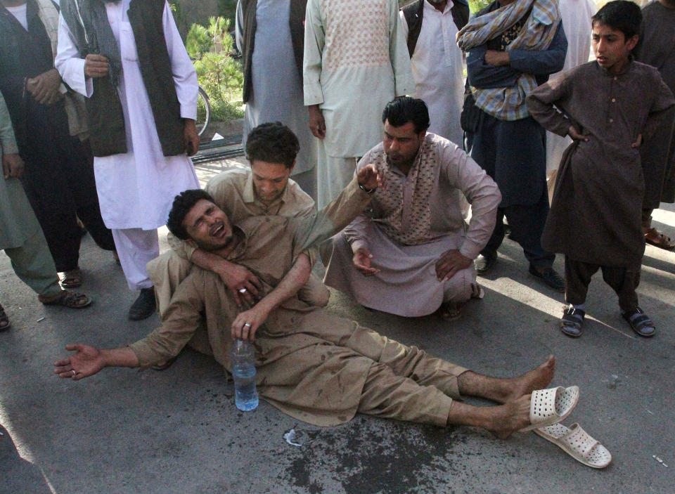 <p>Relatives mourn outside at a hospital, after an overnight suicide attack at a mosque in Herat, Afghanistan, Aug. 2, 2017. (Photo: Mohammad Shoib/Reuters) </p>