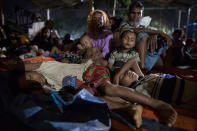 <p>New Rohingya arrivals from Myanmar pack an overcrowded area trying to get some rest while they are waiting for shelter September 29 in Kutupalong, Bangladesh. (Photograph by Paula Bronstein/Getty Images) </p>