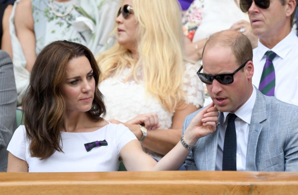 <p>Kate enjoyed a moment of rare public affection with her husband, wiping something off his chin as they attended day 13 of Wimbledon, July 2017. </p>