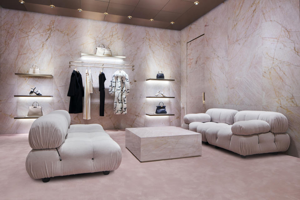 A comfortable seating area, with ready-to-wear and handbags displayed. - Credit: Stephen Busken