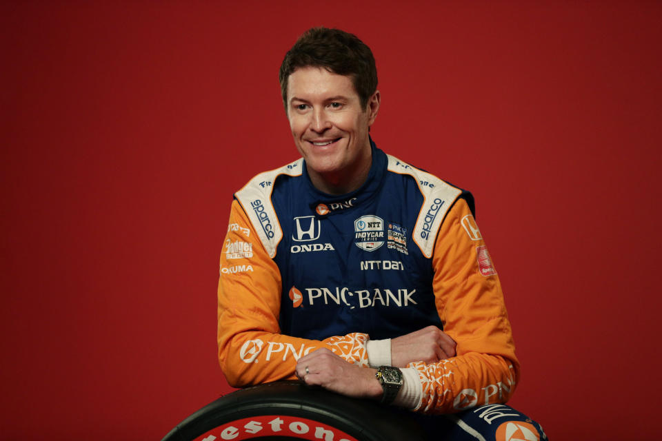 In this Feb. 10, 2020, photo, IndyCar driver Scott Dixon poses for photos during IndyCar Media Day Auto Racing in Austin, Texas. Dixon, Alexander Rossi and the rest of the IndyCar drivers were in sunny Florida around spring break ready to start the season. (AP Photo/Eric Gay)