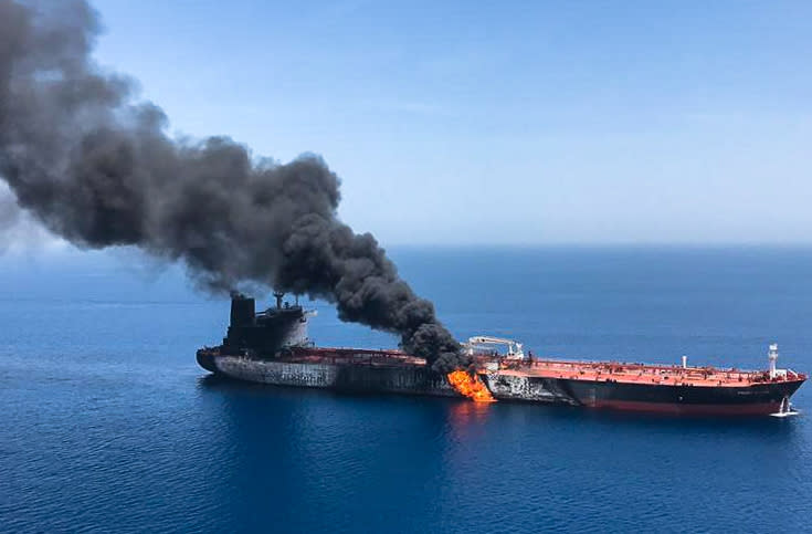 TOPSHOT - A picture obtained by AFP from Iranian News Agency ISNA on June 13, 2019 reportedly shows fire and smoke billowing from Norwegian owned Front Altair tanker said to have been attacked in the waters of the Gulf of Oman. - Suspected attacks left two tankers in flames in the waters of the Gulf of Oman today, sending world oil prices soaring as Iran helped rescue stricken crew members. The mystery incident, the second involving shipping in the strategic sea lane in only a few weeks, came amid spiralling tensions between Tehran and Washington, which has pointed the finger at Iran over earlier tanker attacks in May. (Photo by - / ISNA / AFP)        (Photo credit should read -/AFP/Getty Images)