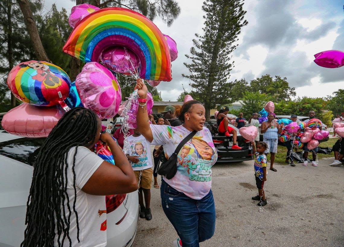 Devera Stukes, at center, holds a balloon release and fish fry to help raise money to pay for her daughter’s funeral seven months after a tragic hit-and-run that killed her daughter Laziyah Stukes,10, two other girls and left several children injured. Family and friends gathered at the Fort Lauderdale home on Saturday, July 16, 2022.