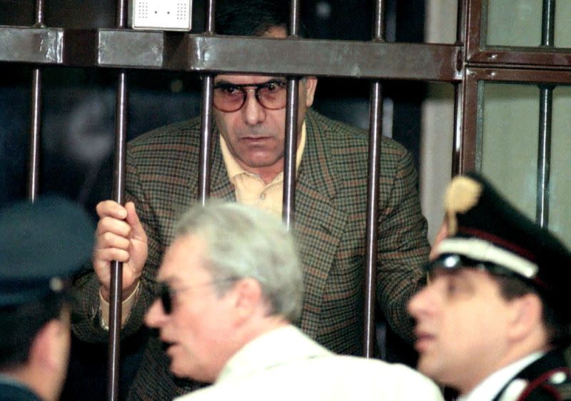 FILE PHOTO: Mafia boss Leoluca Bagarella stand behinds bars at Florence's Santa Verdiana courthouse November 12,..