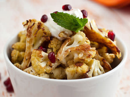 <strong>Get the <a href="http://www.huffingtonpost.com/2011/10/27/cumin-seed-roasted-caulif_n_1062589.html">Cumin Seed Roasted Cauliflower with Salted Yogurt, Mint and Pomegranate Seeds Recipe</a></strong>