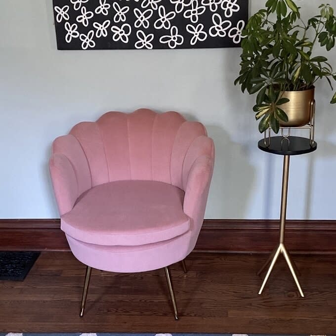 A pink barrel chair in a home