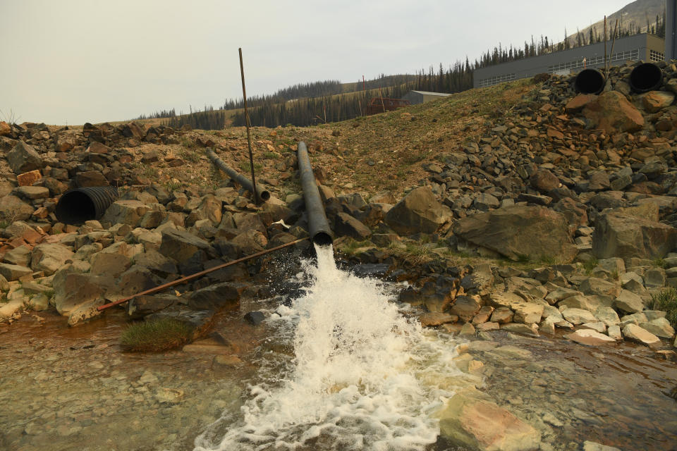 A pipe flows from a state water treatment plant at the Superfund site at Summitville Mine in Summitville, Colorado.  (Photo: RJ Sangosti via Getty Images)