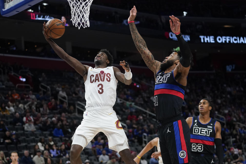 Cleveland Cavaliers guard Caris LeVert (3) drives on Detroit Pistons forward Saddiq Bey (41) in the first half of an NBA basketball game in Detroit, Friday, Nov. 4, 2022. (AP Photo/Paul Sancya)