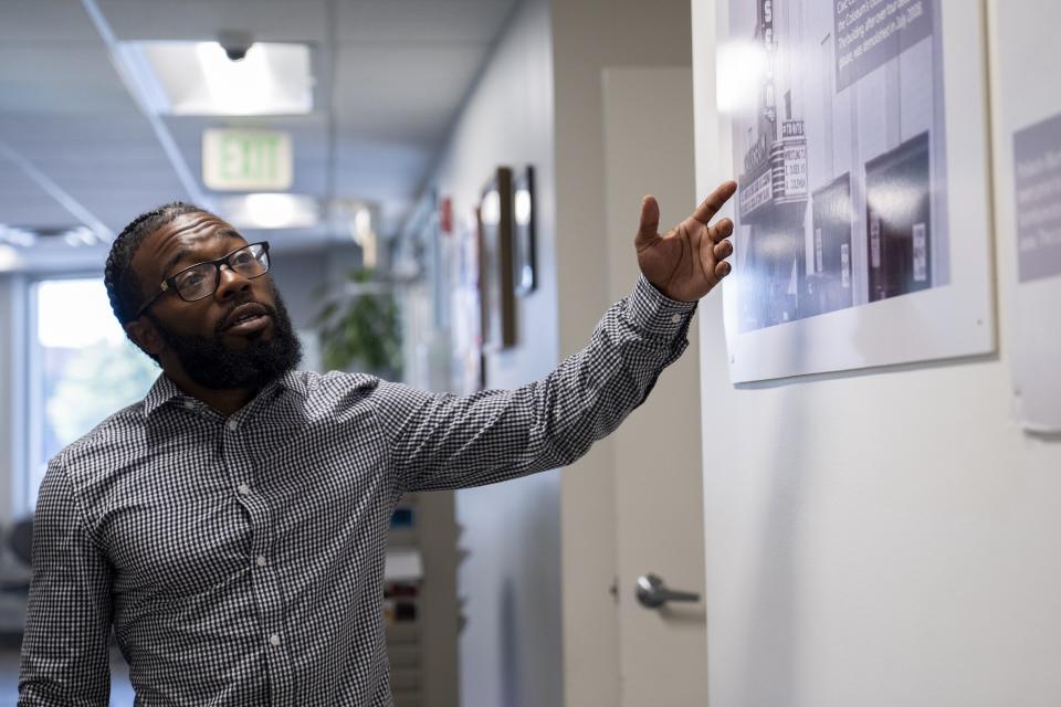 Shiloh Jordan, a Baltimore native whose cannabis conviction was pardoned by an executive order from Maryland Gov. Wes Moore on Monday, walks through the Center for Urban Families in Baltimore where he works, Tuesday, June 18, 2024. (AP Photo/Stephanie Scarbrough)