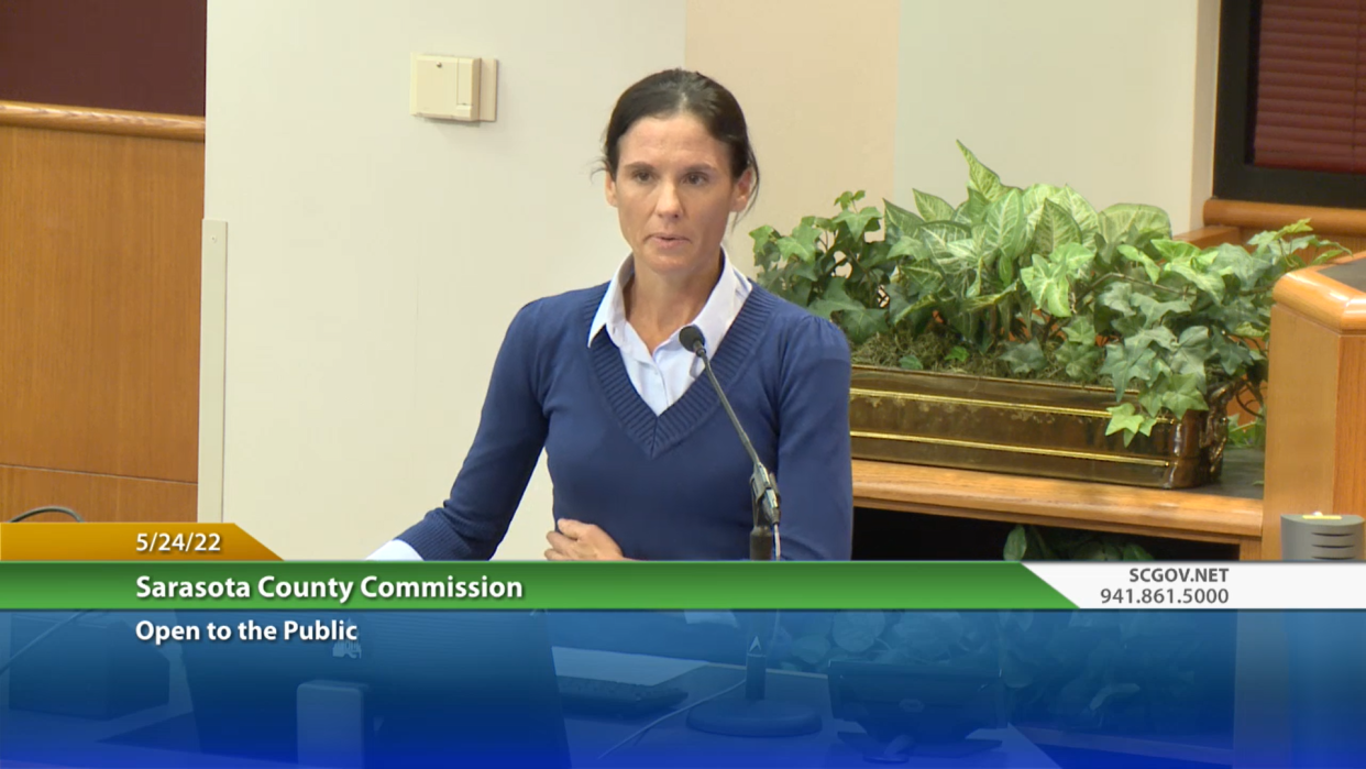 Kristin Stewart addresses the Sarasota County Commission on Tuesday. Stewart, who was run over by a county utility truck two years ago, asked the commissioners to approve a settlement between her and the county.