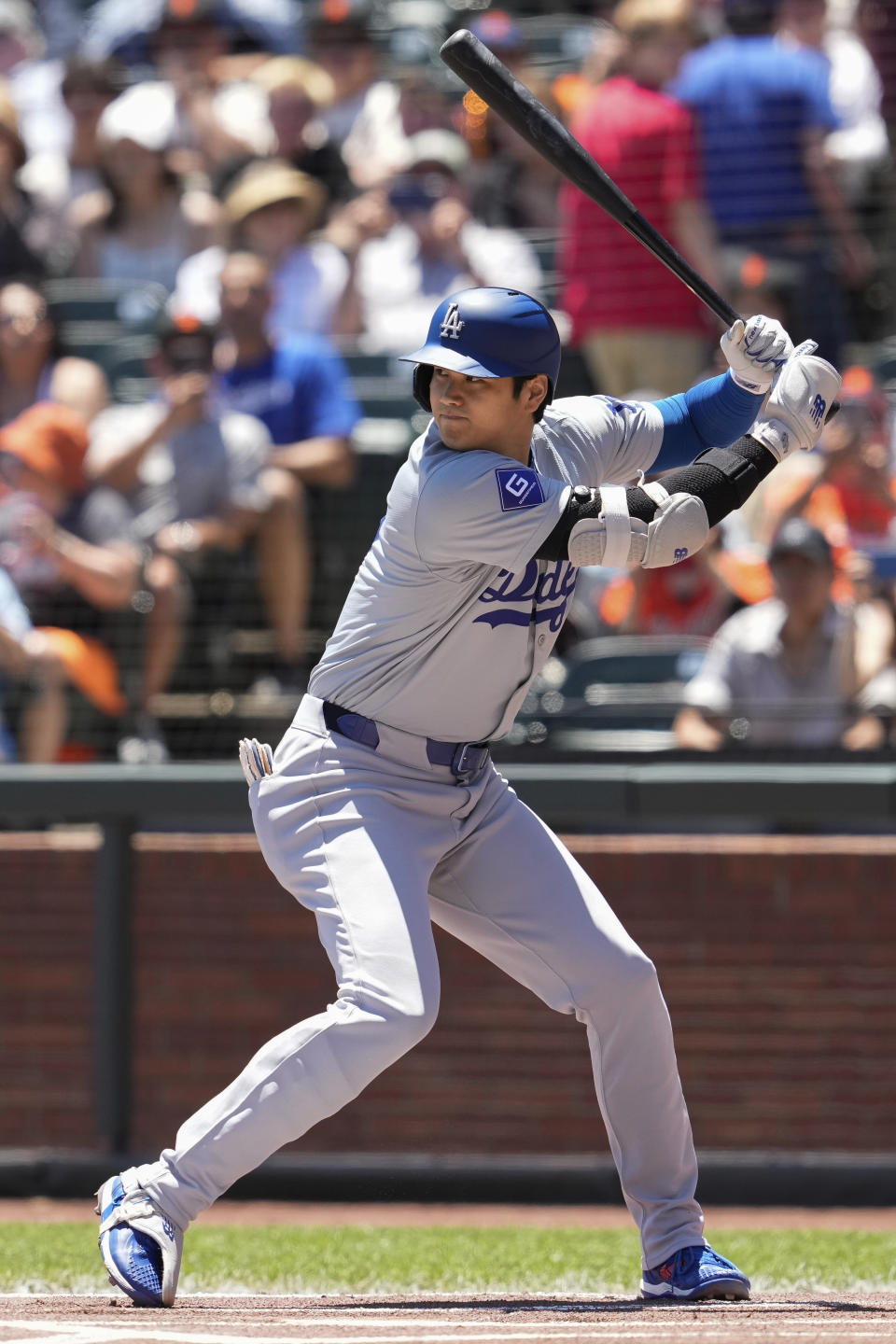 Los Angeles Dodgers' Shohei Ohtani waits for a throw from San Francisco Giants pitcher Spencer Bivens during the first inning of a baseball game Sunday, June 30, 2024, in San Francisco. (AP Photo/Godofredo A. Vásquez)