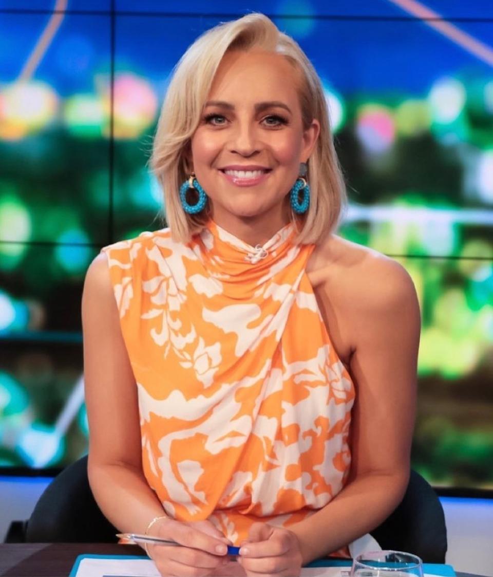 The Project host Carrie Bickmore wearing an orange print dress by Sheike