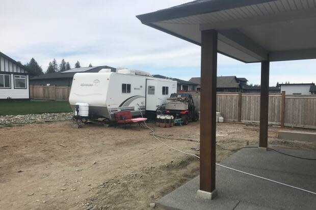 Unable to move into their home, the Staffansons will be living in a camper in their backyard.