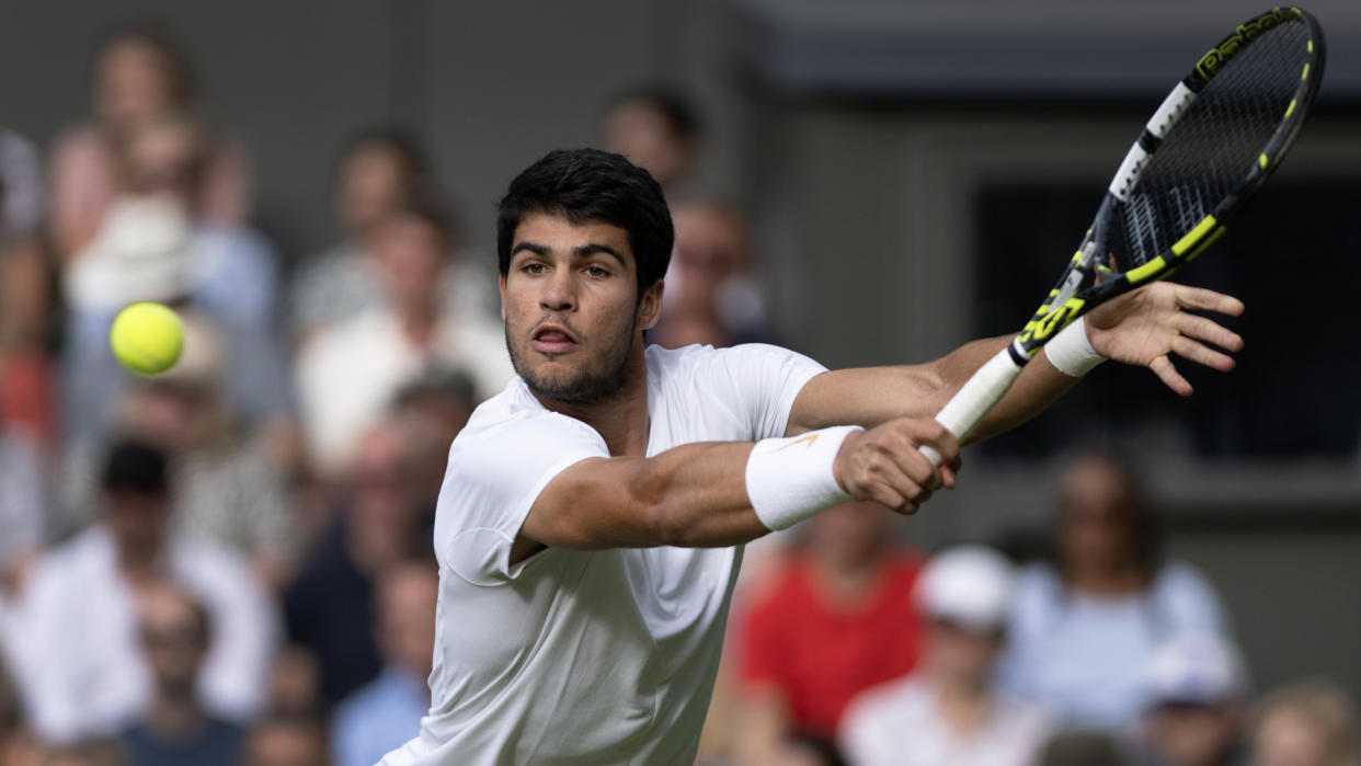  Carlos Alcaraz hits a backhand volley at Wimbledon 