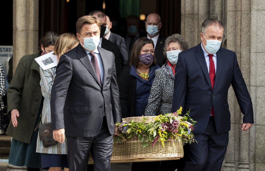 John Hume Jnr (left) and his brother Aidan (right) carry the coffin of their mother Pat Hume (Liam McBurney/PA) (PA Wire)