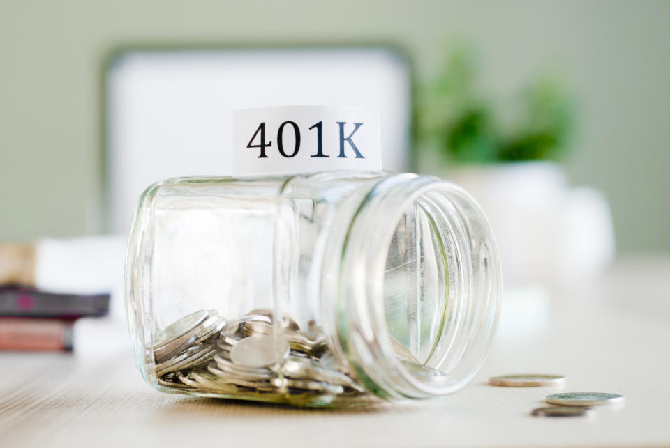 Jar filled with coins with 401(k) written at the top