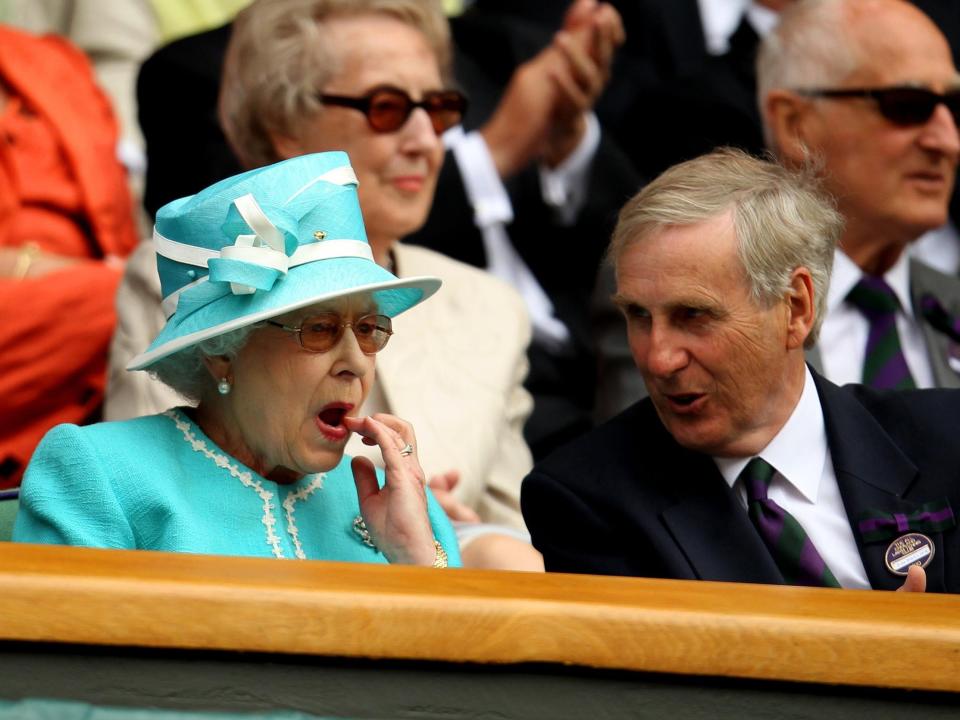 The Queen wipes at Wimbledon in 2010.
