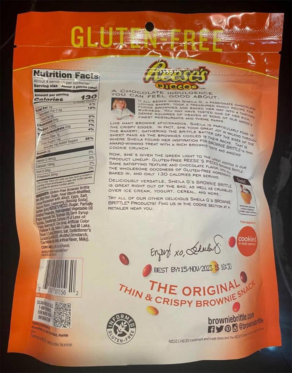 The recalled Gluten-Free Reese’s Pieces Brownie Brittle comes in a 4-ounce pouch with UPC 711747011562 and lot codes SG 1054 15/NOV/2023 1S and SG 1054 15/NOV/2023 2S on the backside of the pouch.