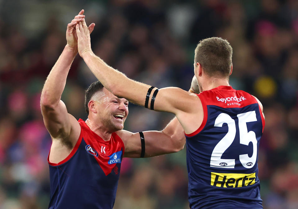 Steven May celebrates a goal.