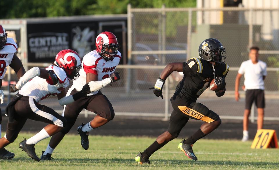 Central’s Cortez Stone breaks free for a huge run that grabs the touchdown against Manual.Aug. 19, 2022