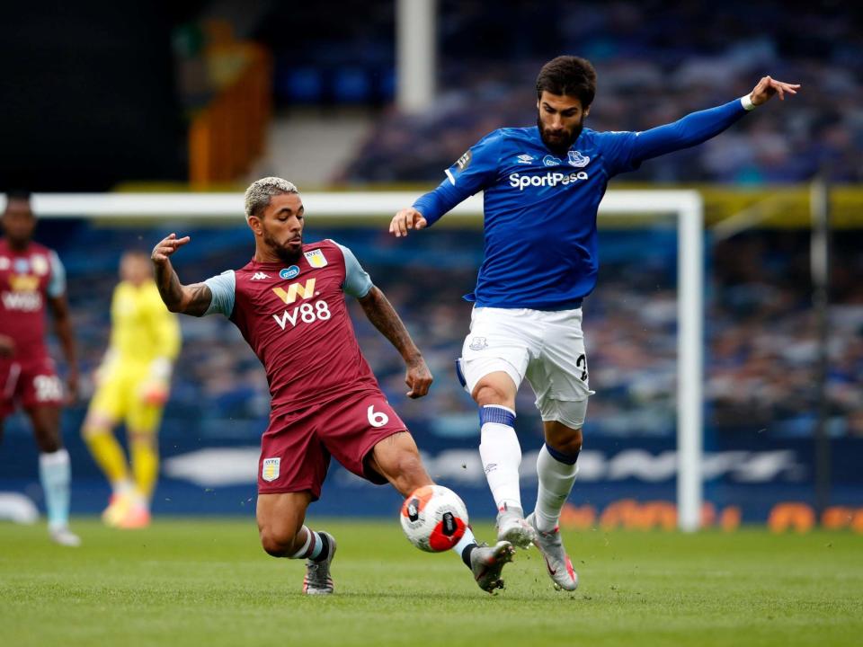 Douglas Luiz of Aston Villa tackles Andre Gomes: Getty Images