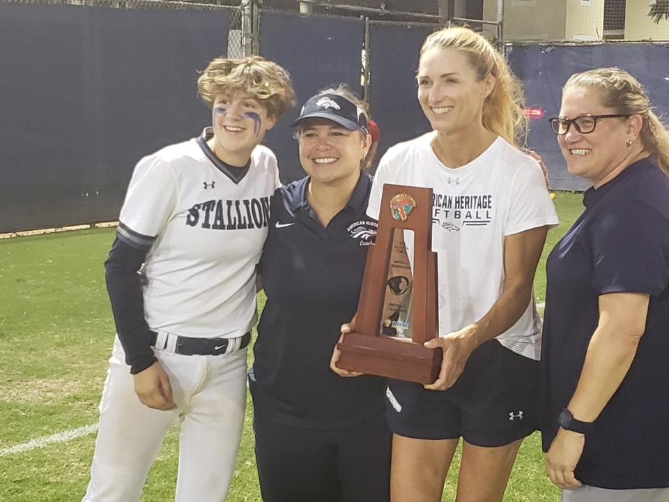 American Heritage-Delray softball players and coaches celebrate the Stallions' district title on May 5, 2022.