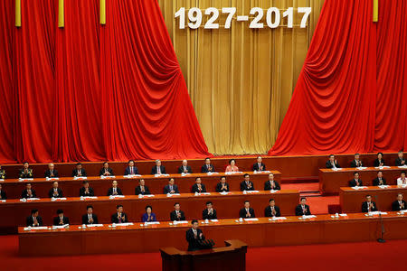 China's President Xi Jinping claps as he delivers a speech during the ceremony to mark the 90th anniversary of the founding of the China's People's Liberation Army at the Great Hall of the People in Beijing, China August 1, 2017. REUTERS/Damir Sagolj