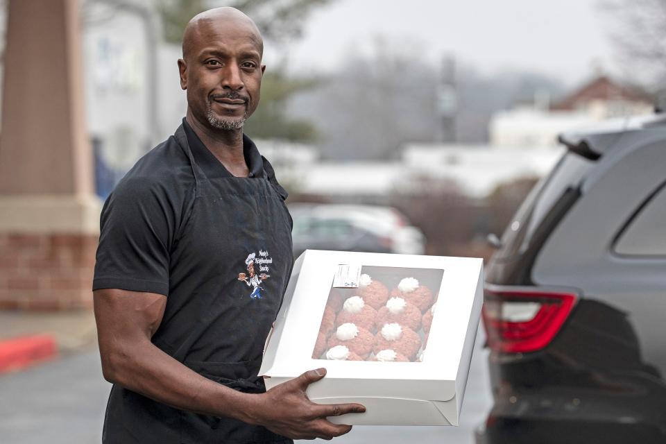 Football player-turned-baker Donavon "Monty" Alderman of Monty's Neighborhood Snacks arrives at the Police Athletic League of Wilmington to hand out his strawberry cupcakes on Wednesday, Dec. 7, 2022. Alderman will be a contestant on the Food Network program "Bake It ‘Til You Make It," premiering Dec. 26.