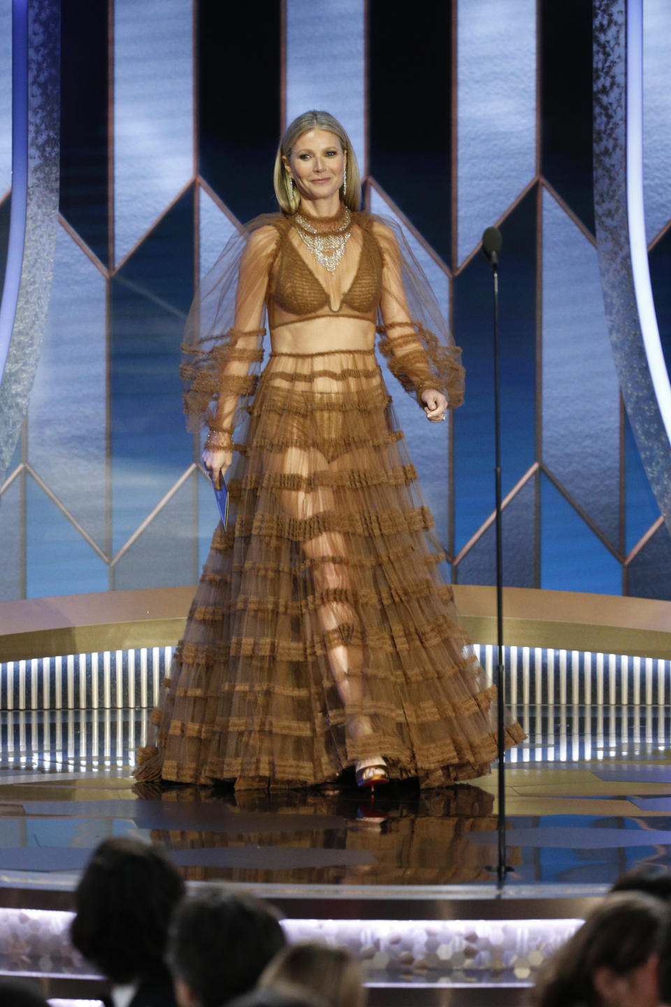 Gwyneth Paltrow walks on stage at the 2020 Golden Globes in a sheer Fendi dress