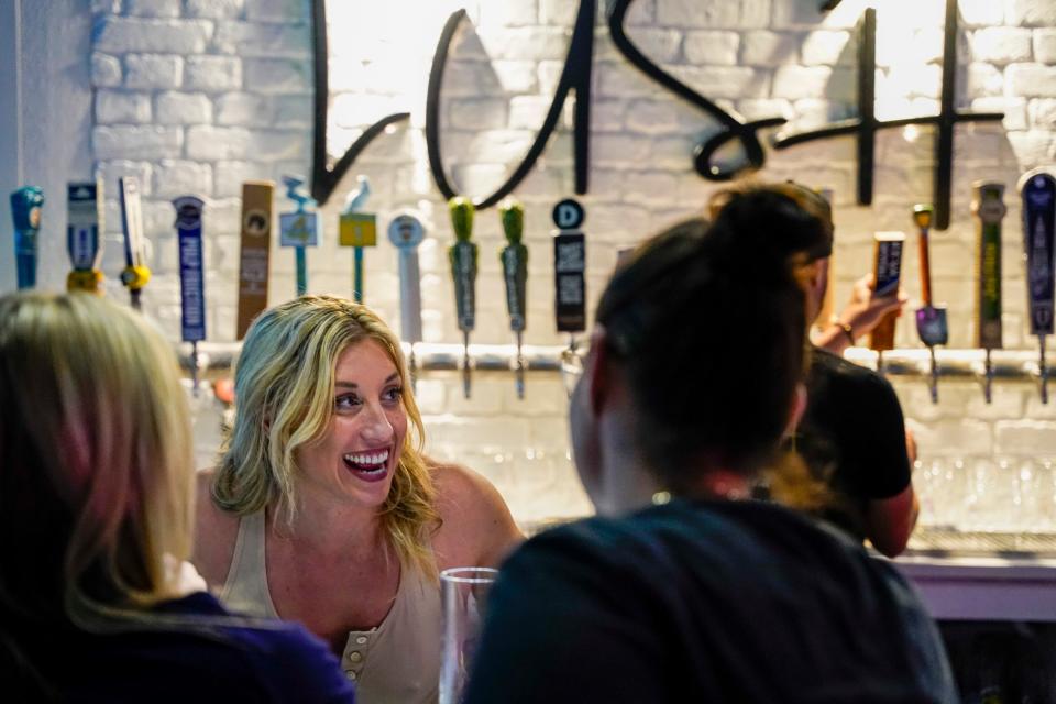 Co-owner Amanda Bussett speaks to customers at Lush Lounge in downtown Stuart on Wednesday, Nov. 17, 2021. “It’s a vibe. People are coming in and thanking us for bringing West Palm to Stuart,” said Bussett. Lush Lounge opened on Nov. 4, 2021 and serves wine, craft beer, select cocktails and charcuterie.